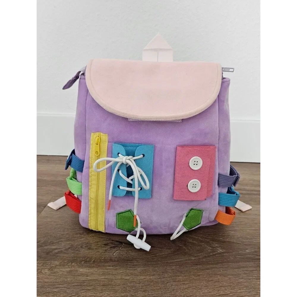 White Dolphin ToysโKids Busy Board Backpack in Lavender and Pink